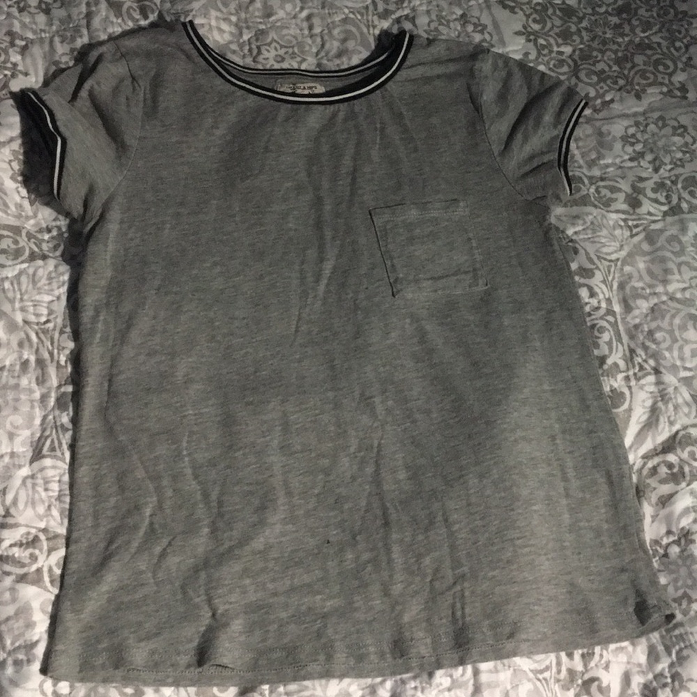 Grey shirt with black and white stripes around